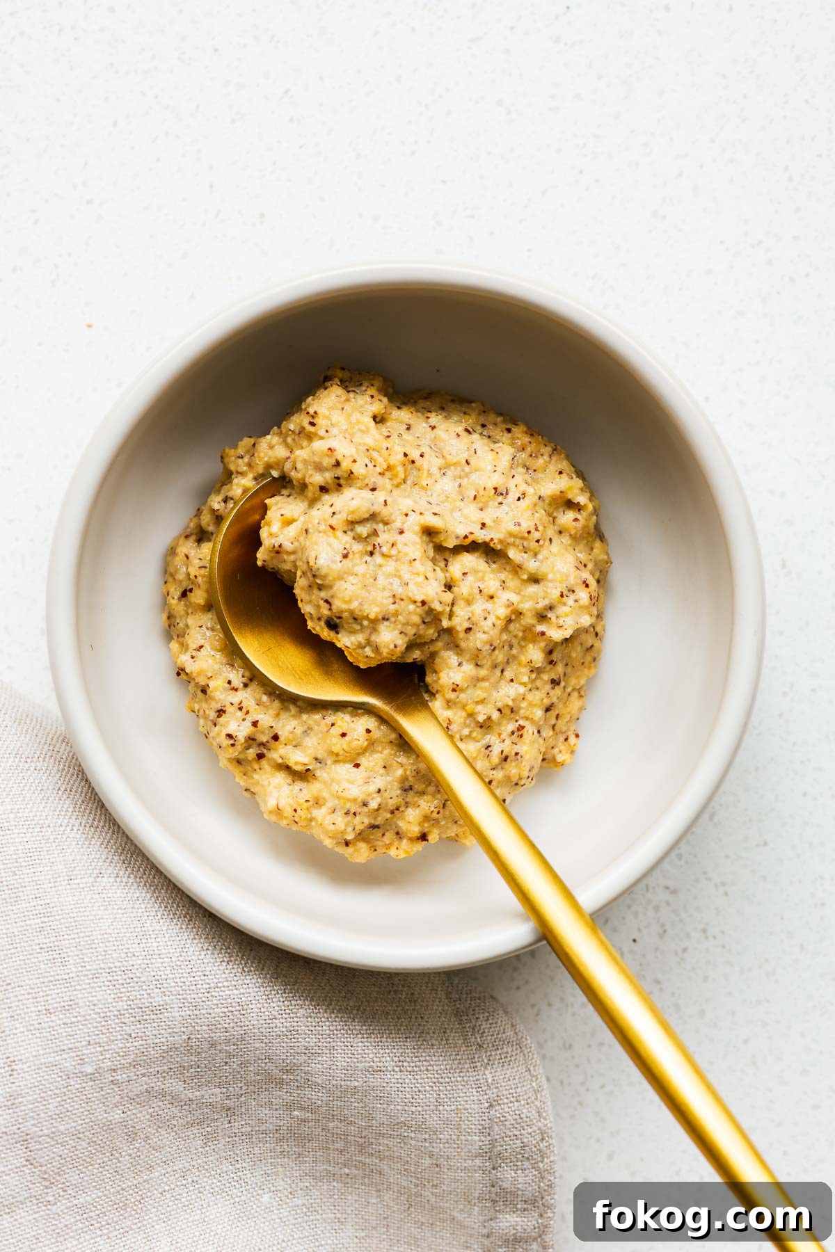 A bowl of Dijon mustard made from ground mustard seeds, white wine vinegar and salt.