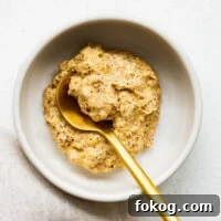 A bowl of Dijon mustard made from ground mustard seeds, white wine vinegar and salt.