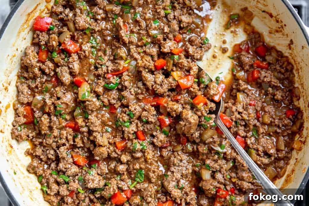 Close up of the cooked beef mixture in a skillet.