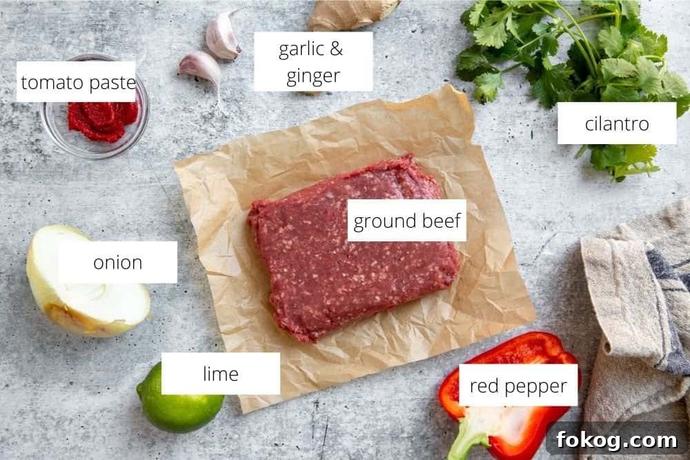 The ingredients for the beef lettuce wraps filling, arranged on a work surface with labels.