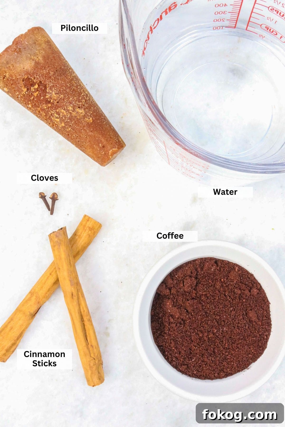 Ingredients for Cafe de Olla Recipe: piloncillo, water, coffee, cloves, cinnamon sticks