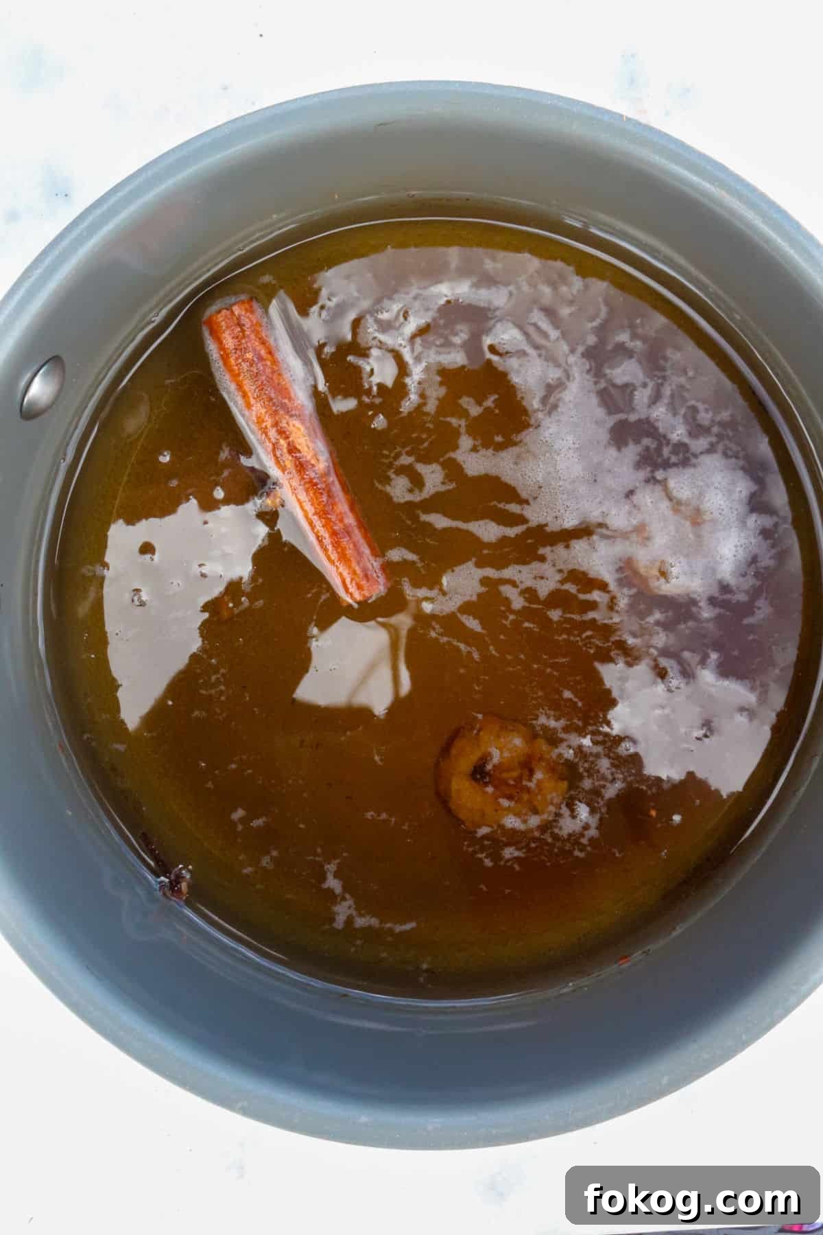 Small pot with water and simmering spices for cafe de olla