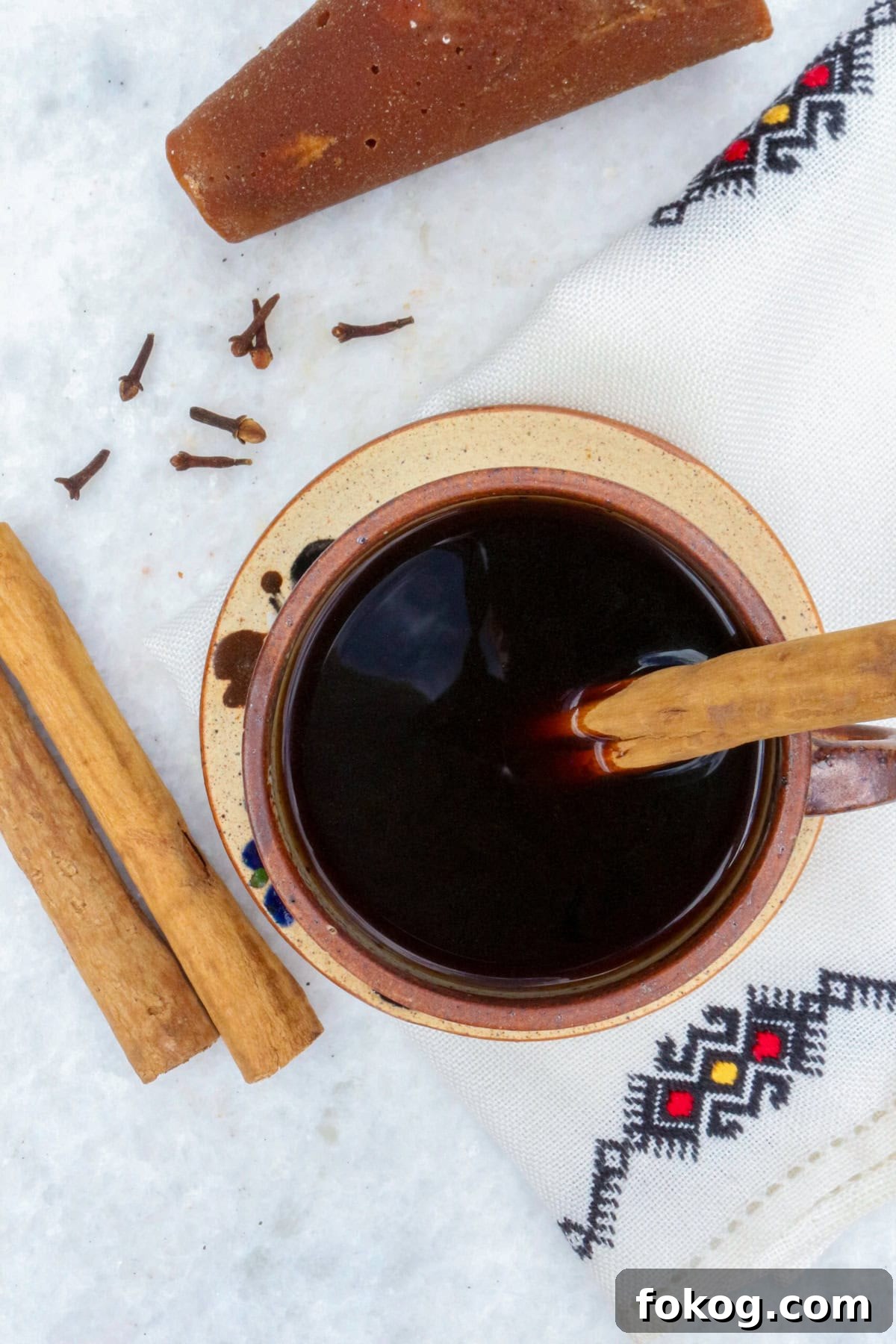 Authentic Cafe de Olla Recipe, bird's eye of a coffee in a mug with a cinnamon stick