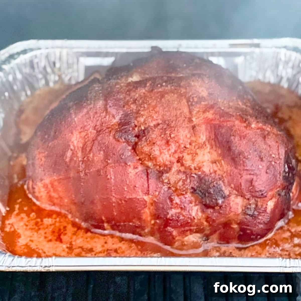 The ham smoking on the pit boss pellet grill.