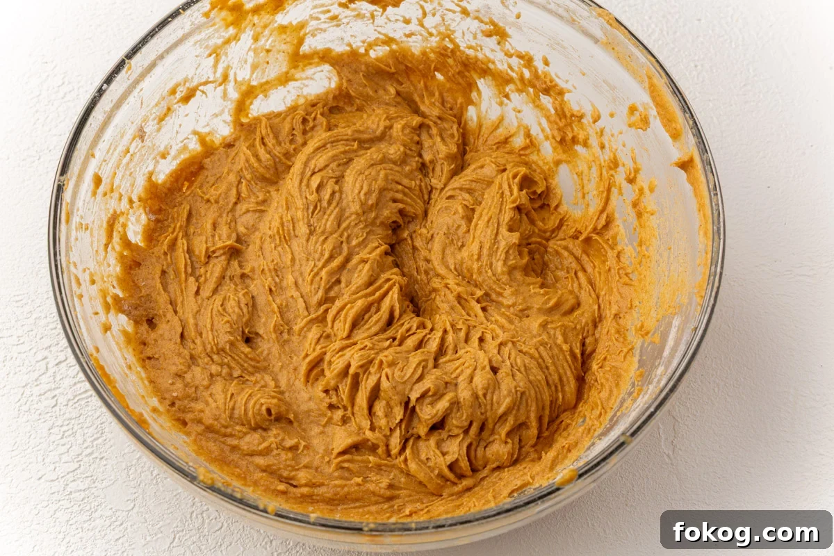 Thick pumpkin coffee cake batter fully mixed and ready to be spread into the pan.
