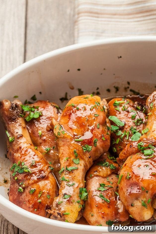 41 Juicy Chicken Drumstick Recipes You’ll Want Tonight 13 Honey Soy Chicken stacked on a dish