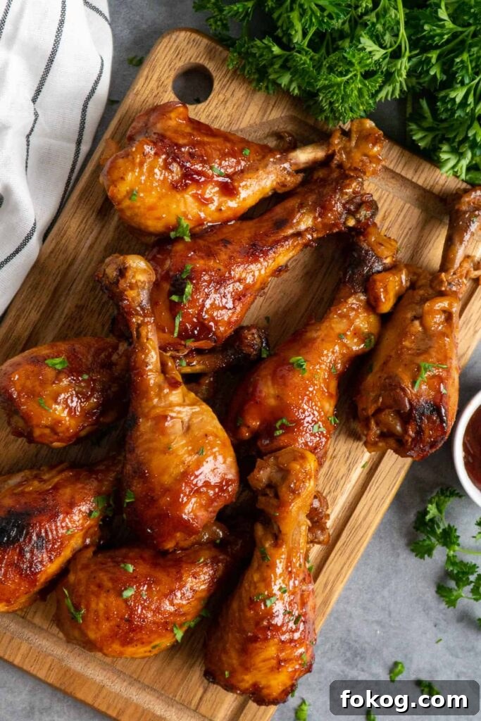 41 Juicy Chicken Drumstick Recipes You’ll Want Tonight 17 Slow Cooker BBQ Chicken Drumsticks on a wooden cutting board