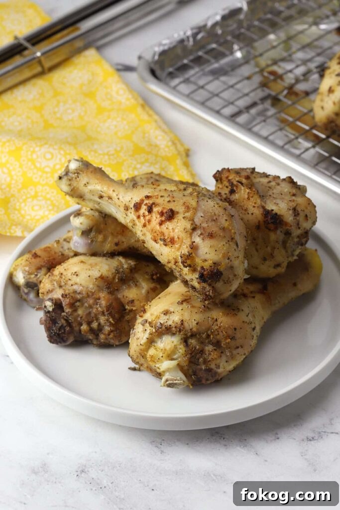 41 Juicy Chicken Drumstick Recipes You’ll Want Tonight 19 Lemon Pepper Chicken Drumsticks served in a large plate