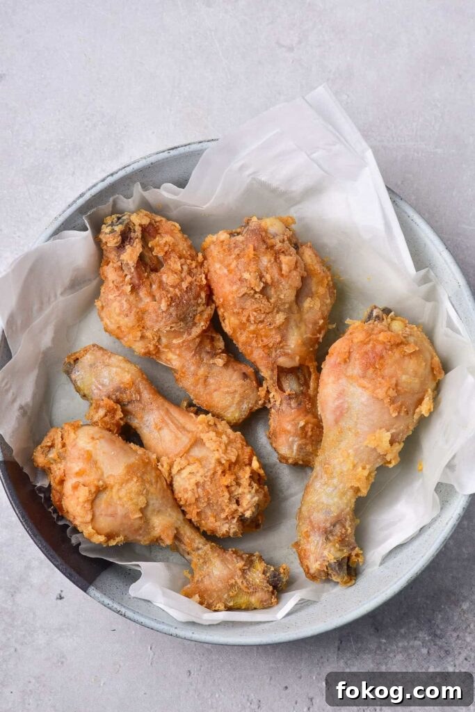 41 Juicy Chicken Drumstick Recipes You’ll Want Tonight 21 Deep Fried Chicken Drumsticks placed on a plate