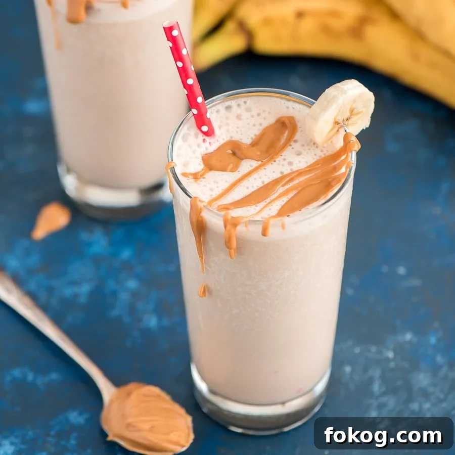 Salty & sweet peanut butter and banana smoothie makes a satisfying breakfast or afternoon snack, packed with protein and flavor! Peanut Butter and Banana Smoothie in a glass with a straw.