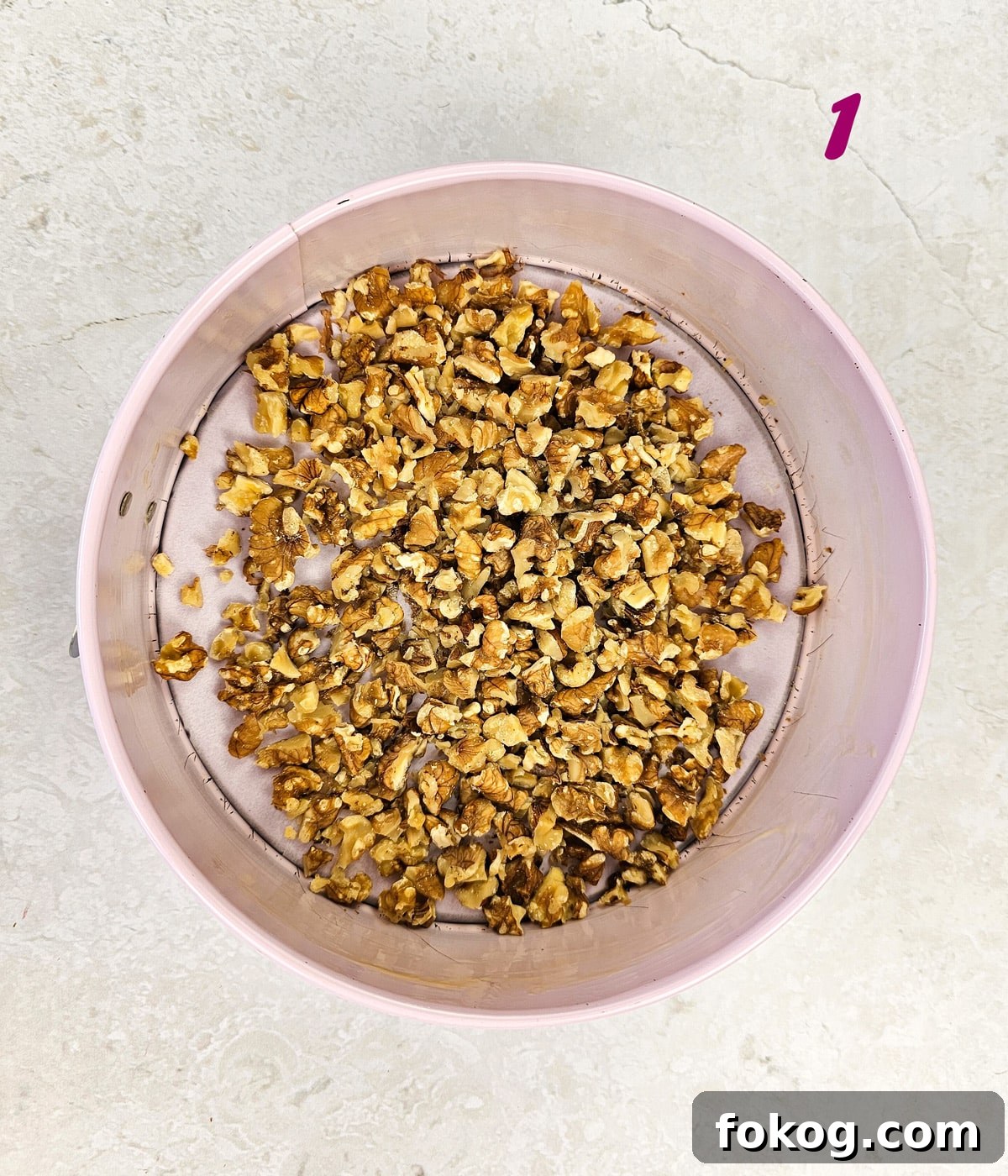 Walnuts in a baking pan.