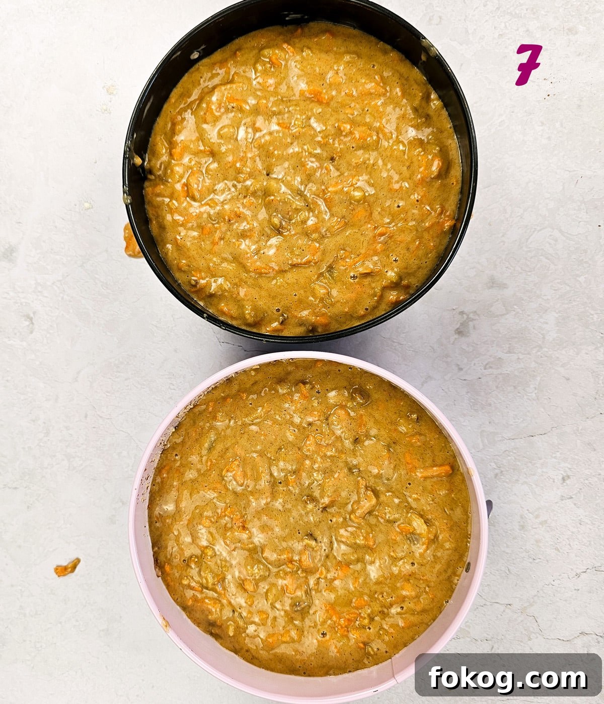 Carrot Cake with pinapple batter in cake pans.
