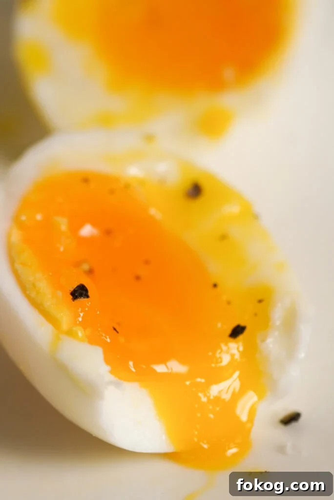 How to Make Soft-Boiled Eggs in an Air Fryer 3 drippy air-fryer soft boiled egg with a bite taken out