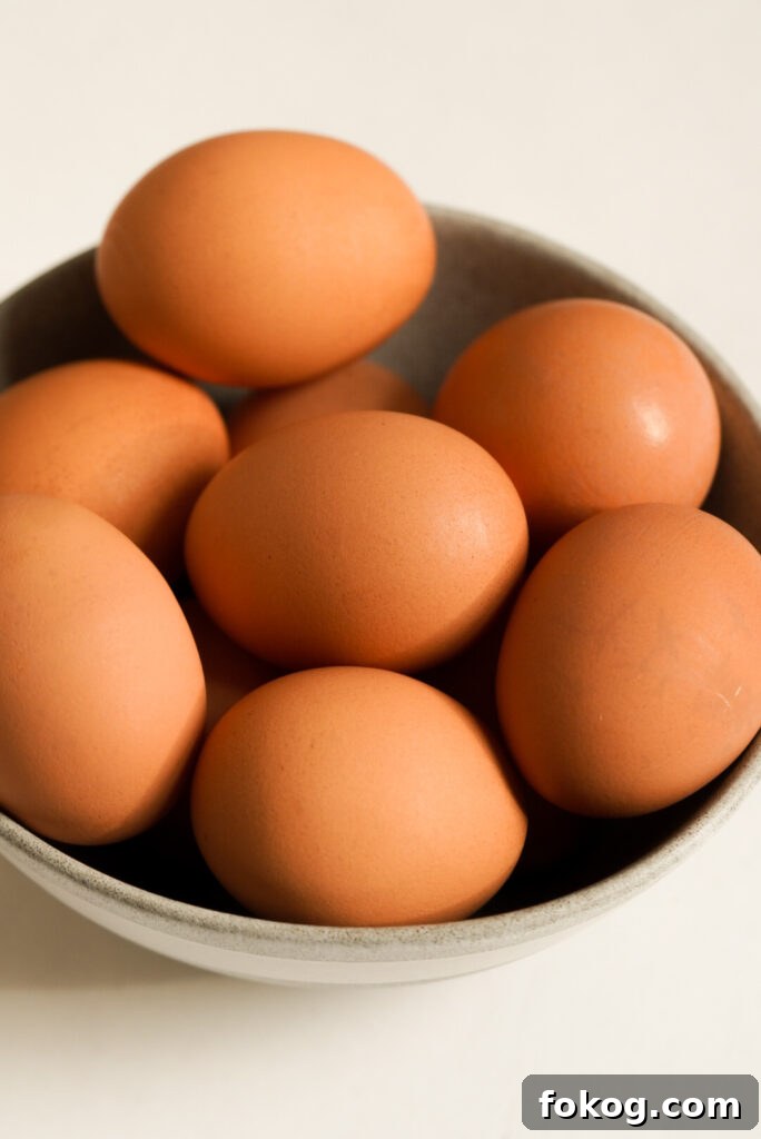 How to Make Soft-Boiled Eggs in an Air Fryer 4 raw eggs in a bowl