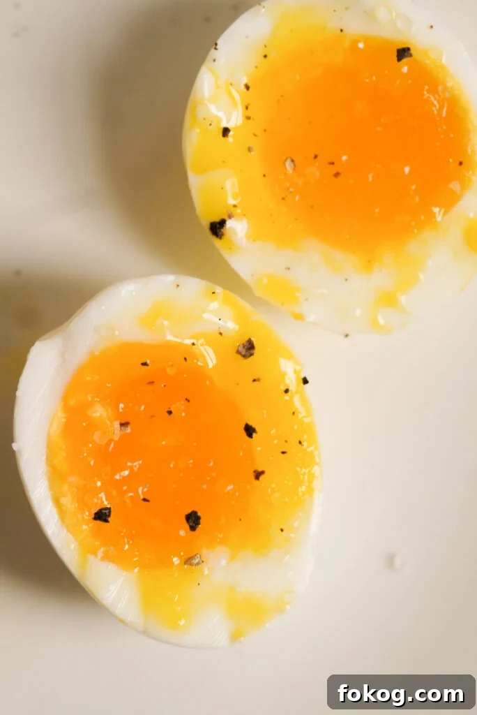 How to Make Soft-Boiled Eggs in an Air Fryer 10 boiled egg cut in half with salt and pepper