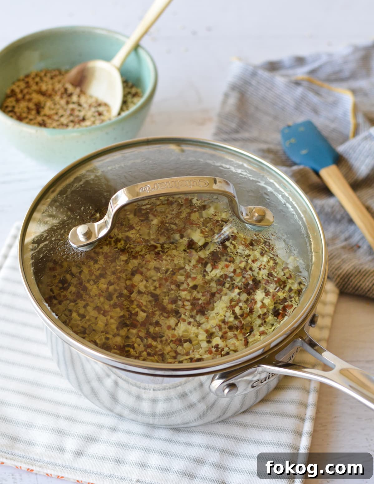 How to Cook Tri-Color Quinoa: Perfect Fluffy Results 5 cooked quinoa in a saucepan with a lid