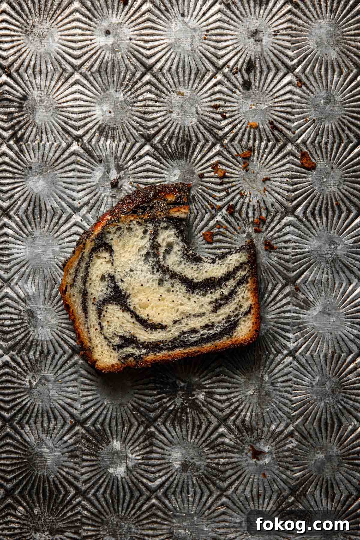 Poppy Seed Babka Recipe: Classic Swirled Pastry 12 A piece of filled sweet bread.