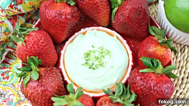 Key Lime Cheesecake Dip surrounded by strawberries