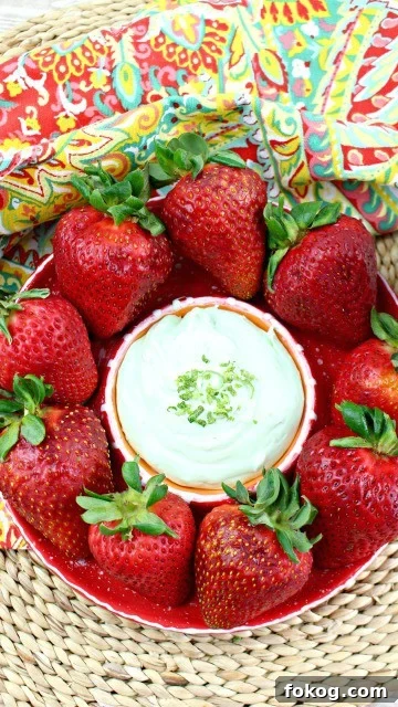 easy key lime dip in a bowl with strawberries