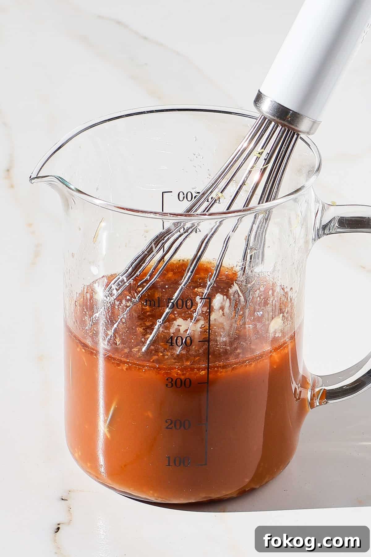 Stir fry sauce in a jug.